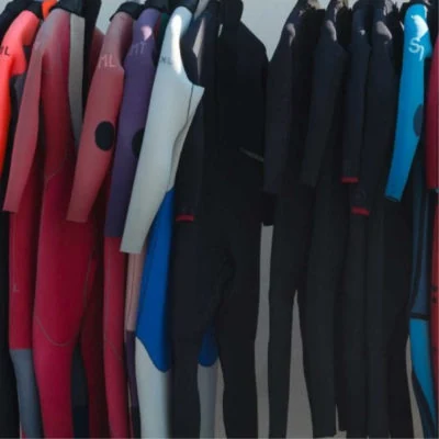Wet suits hanging for rental